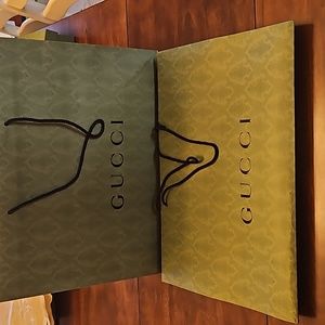 2 large Gucci shopping bags